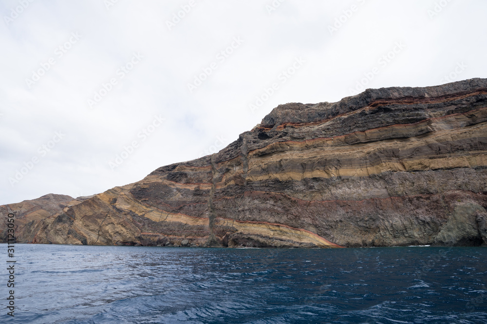 Rocky shore in the easternmost peninsula of Portuguese island Madeira, Sao Lourenco Point (locally known as Vereda da Ponta de Sao Lourenco). Waves breaking over volcanic cliffs.