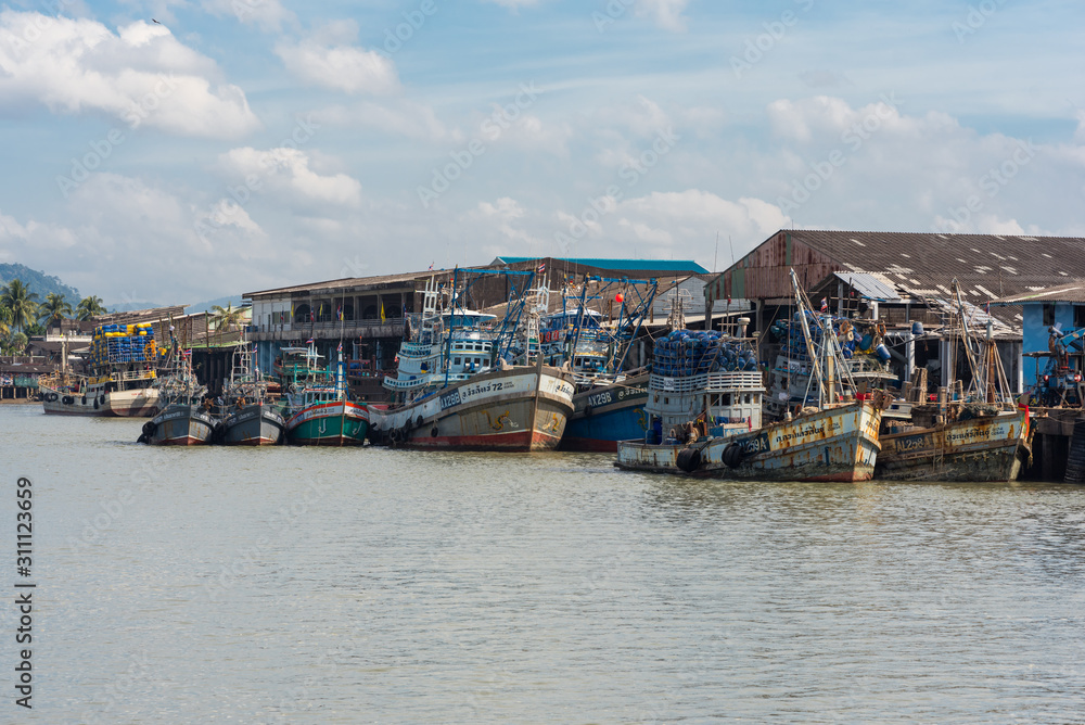 Parts of the fishing fleet are moored at the pier in the industrial estate of the Ranong fishing harbor in the south-west of Thailand