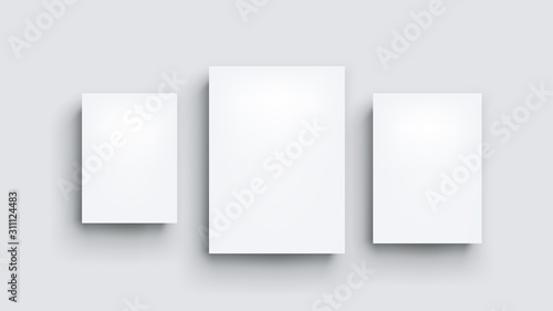 three white boards on grey