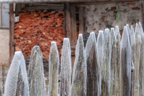Snow on wooden fence