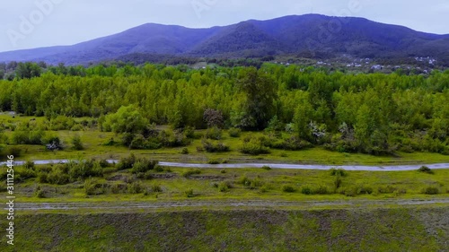 Green landscape with drone view of mountains