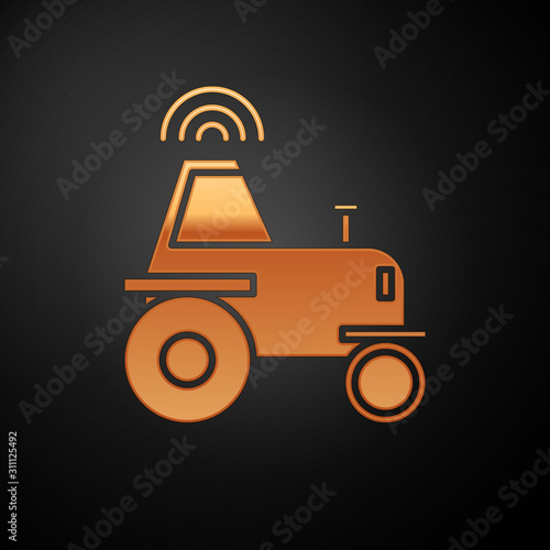 Gold Self driving wireless tractor on a smart farm icon isolated on black background. Smart agriculture implement element. Vector Illustration