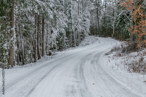 Winding snow covered road landscape