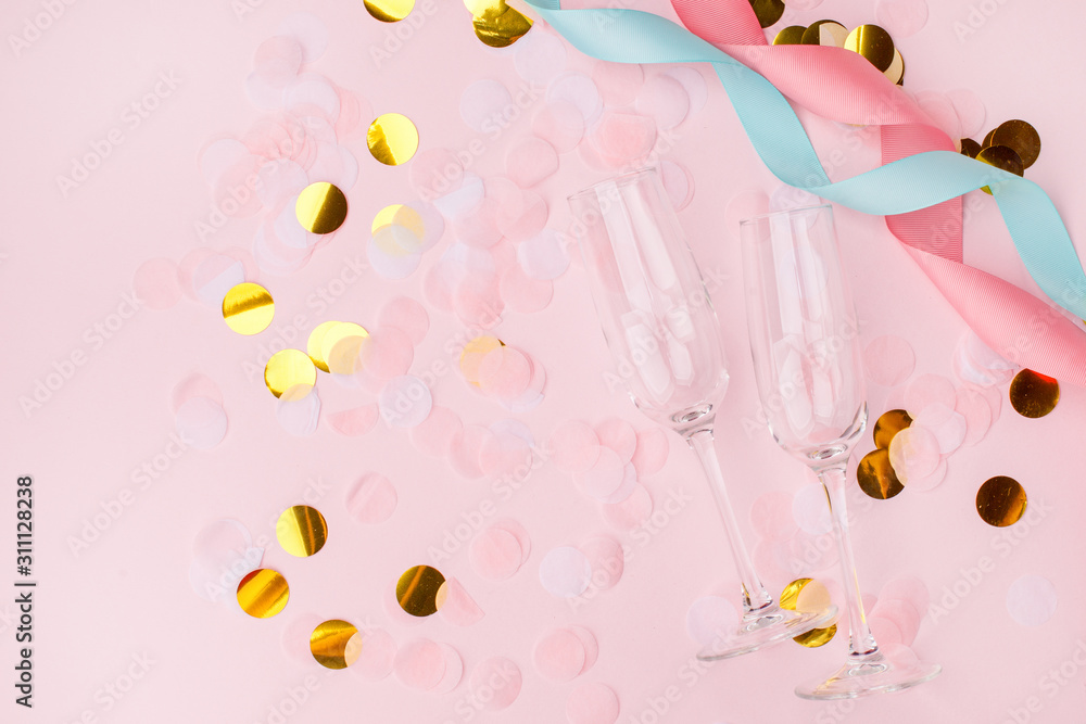wineglasses on a pink background. Background for holiday, birthday, wedding, Valentine's day, Women's Day party. Top view, flat lay composition. Copy space for design. wineglasses on a pink background. Background for holiday, birthday, wedding, Valentine's day, Women's Day party. Top view, flat lay composition. Copy space for design.