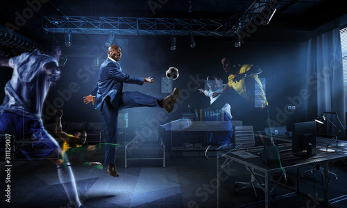 Soccer man in action with ball. Mixed media