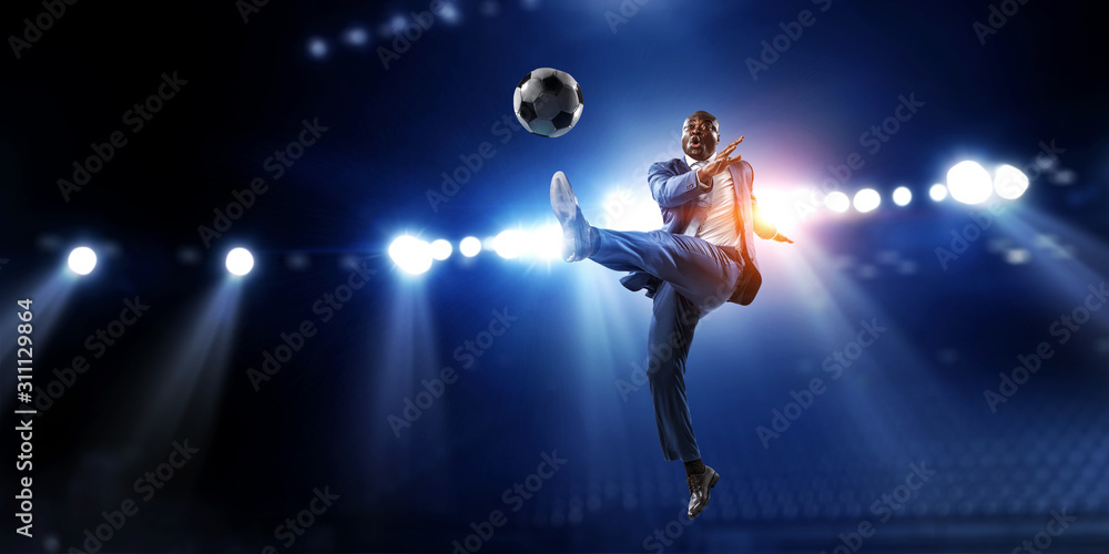 Soccer businessman in action with ball. Mixed media