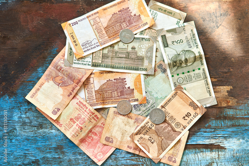 Indian rupees. Indian money, banknotes, and coins in denominations of 1, 2, 10, 20, 200, 500. 