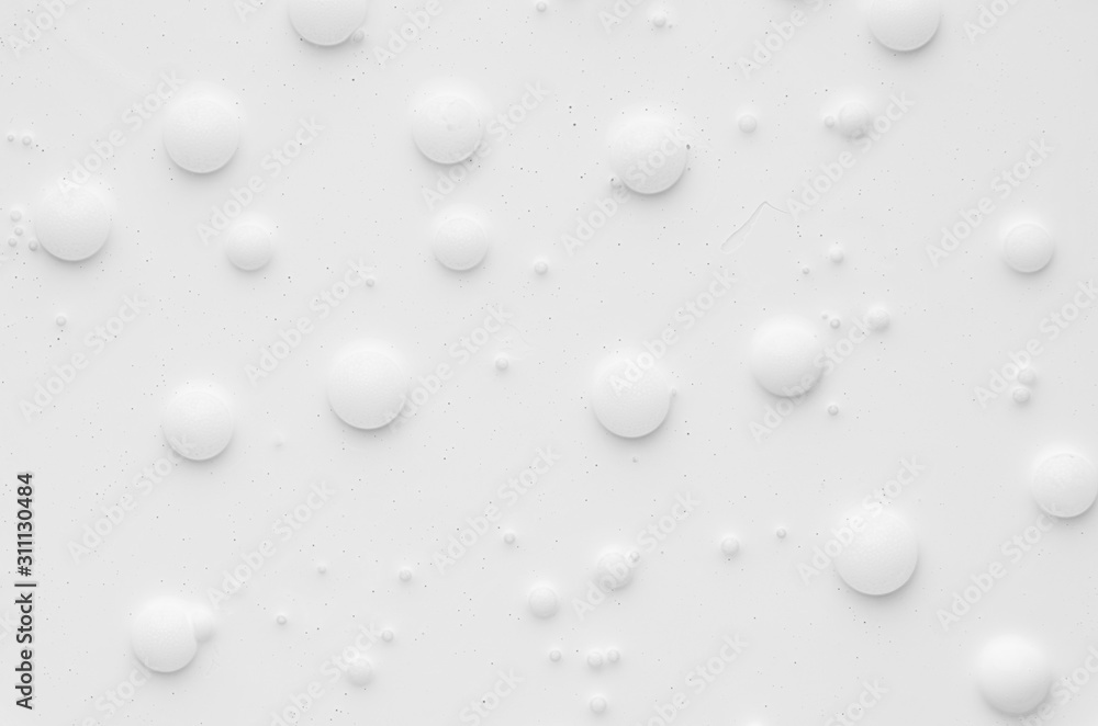 White liquid paint texture with random bubbles and stains as modern abstract background.