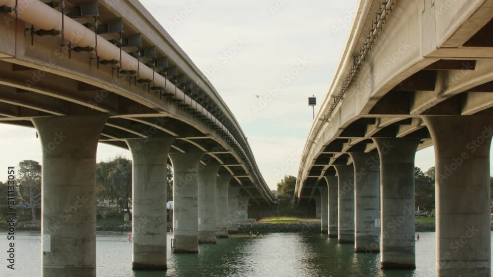 Tilting shot underneath two street bridges Tilting shot underneath two street bridges