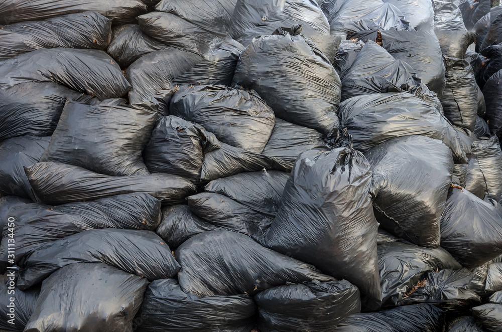 garbage bags, background. A lot of garbage bags piled up garbage bags, background. A lot of garbage bags piled up