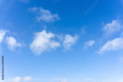 Fototapeta Naklejka Na Ścianę i Meble -  Beautiful form of white fluffy clouds on vivid blue sky in a suny day