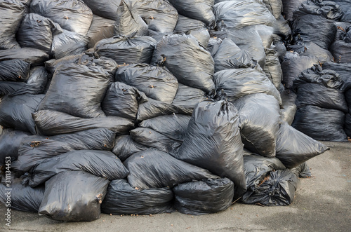 garbage bags, background. A lot of garbage bags piled up