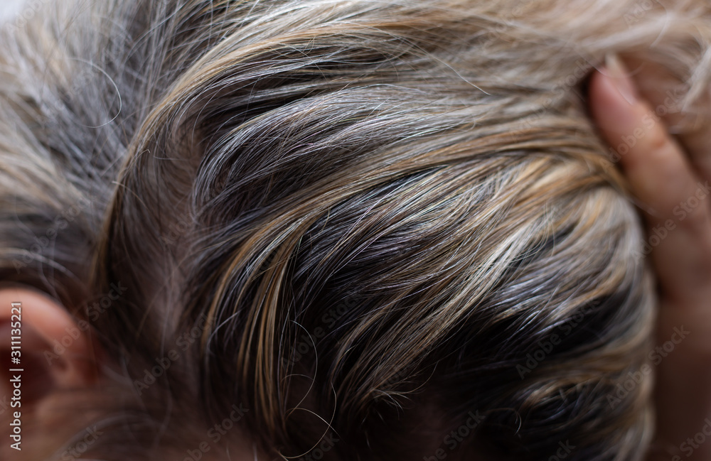 Closeup sad asian young beautiful woman and gray hair Closeup sad asian young beautiful woman and gray hair