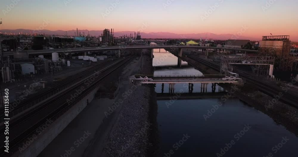 Aerial panorama of Rail Yard, San Pedro, California. Shipping industrial freight train yard during the purple sunset, drone dolly out shot Aerial panorama of Rail Yard, San Pedro, California. Shipping industrial freight train yard during the purple sunset, drone dolly out shot