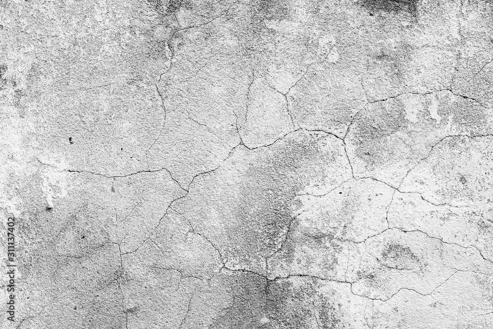 Texture of a concrete wall with cracks and scratches which can be used as a background