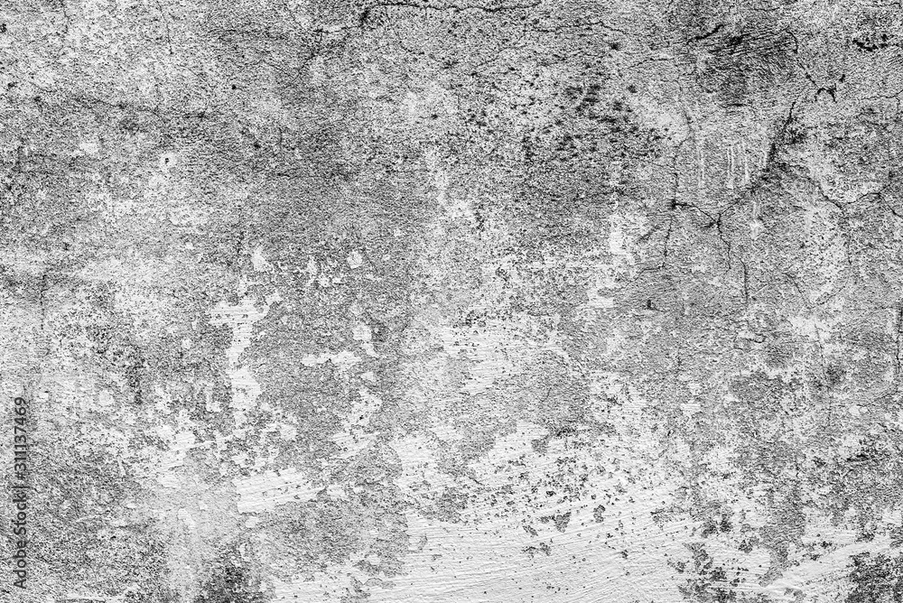 Fototapeta premium Texture of a concrete wall with cracks and scratches which can be used as a background