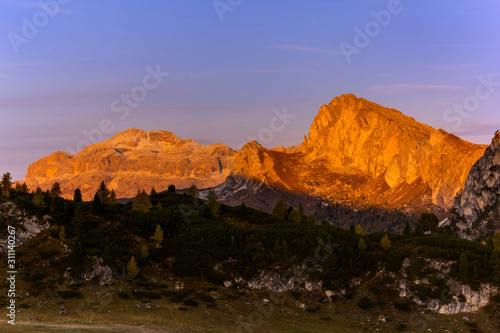  Sunrise over mountain range at Falzarego Pass in autunm season, Belluno Pronince, Dolomites, South Italy photo