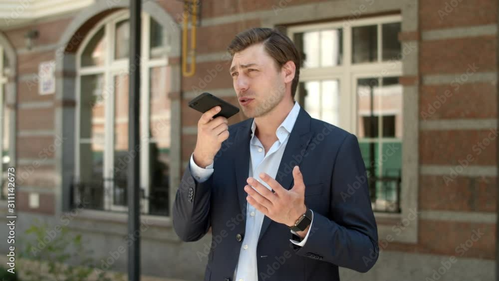 Closeup entrepreneur having phone conversation. Man recording voice messages Closeup entrepreneur having phone conversation. Man recording voice messages
