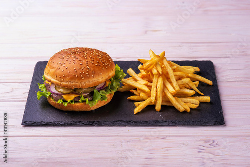 hamburger with bacon on wooden background