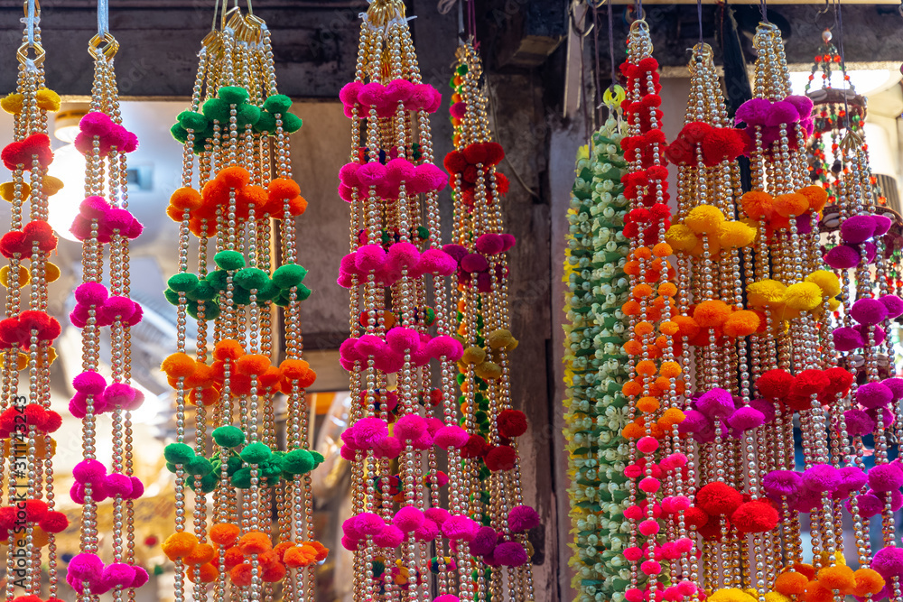 Colorful hanging decorations on display for sale in Chandi Chowk Old Delhi.