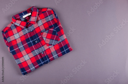 Textile, shirt composition on color background. Flat lay.