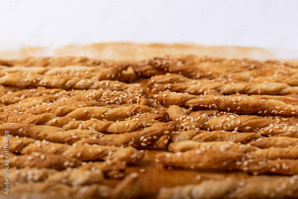 Homemade puff pastry sticks with sesame seeds Homemade puff pastry sticks with sesame seeds