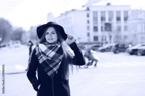 Black and white photo of a young girl on a walk