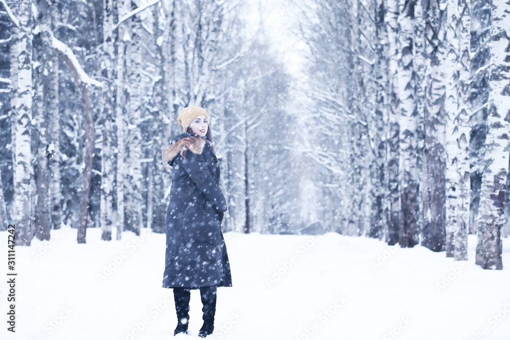 Beautiful girl in a beautiful winter snow