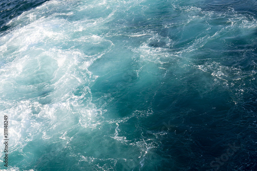  white foam in the seething blue sea