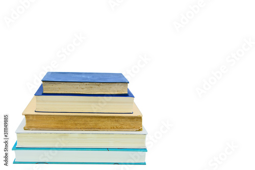 Books, stacked over one another in front of a white background © Boris