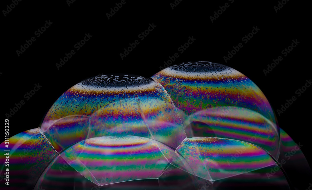 Soap bubbles with a pattern on a black background Soap bubbles with a pattern on a black background