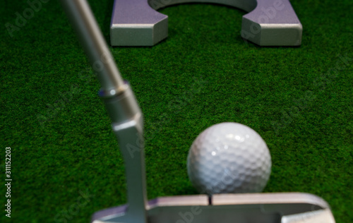 Artificial turf in front of the mini golf hole