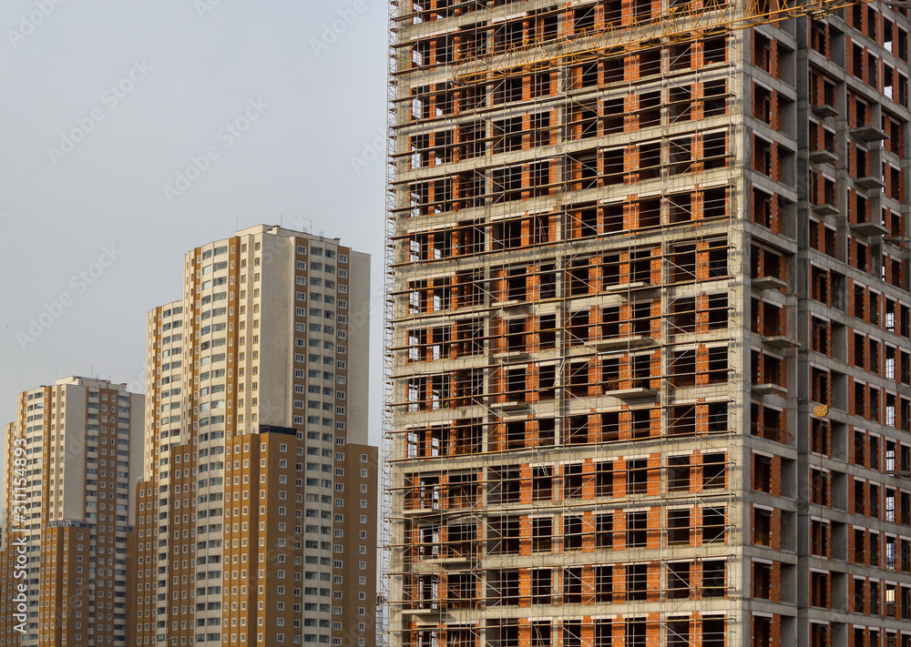 Construction of multi storey residential house and office. Modern building under construction