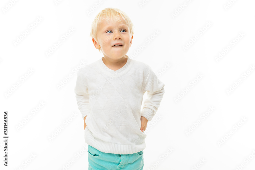 charming blond boy in a white t-shirt thinking on a white background charming blond boy in a white t-shirt thinking on a white background