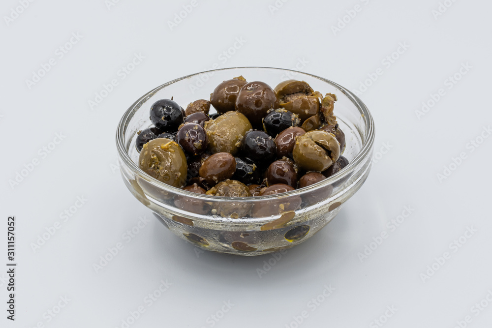 Mixture of olives seasoned with olive oil, garlic and oregano Mixture of olives seasoned with olive oil, garlic and oregano