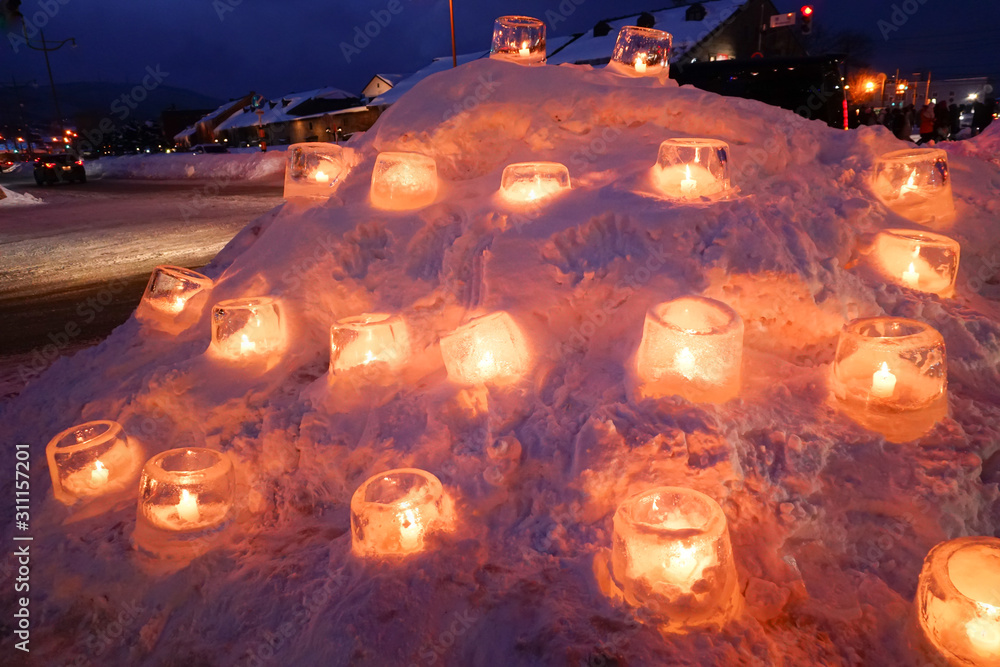 Candle light in ice and snow on Christmas day Candle light in ice and snow on Christmas day