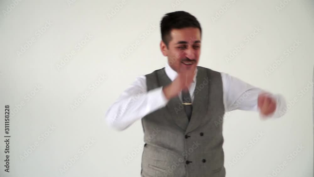 A joyful man vigorously plays invisible drums. Oriental happy man A joyful man vigorously plays invisible drums. Oriental happy man