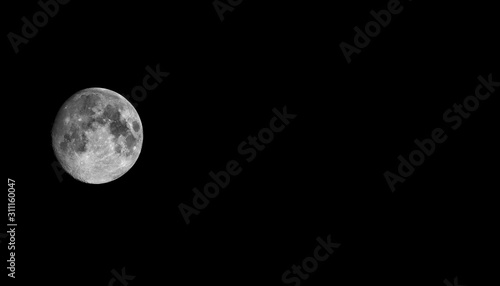 The Moon is the Earth's largest natural satellite and can be seen in the night sky.