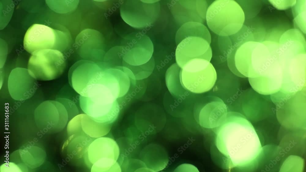 Beautiful abstract holiday green and black blurry shiny colorful bokeh video background. Real time full hd footage. Beautiful abstract holiday green and black blurry shiny colorful bokeh video background. Real time full hd footage.