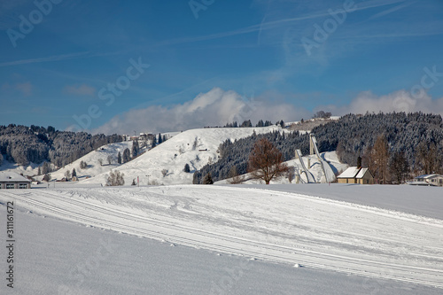 Langlaufloipe mit Sprungschantze in Einsiedeln, Schweiz photo