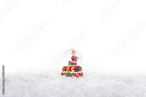 Water Globe. Christmas water globe with Santa Claus. Christmas decoration glass ball water ball globe with snow and Santa Claus. Christmas decoration on white background. photo