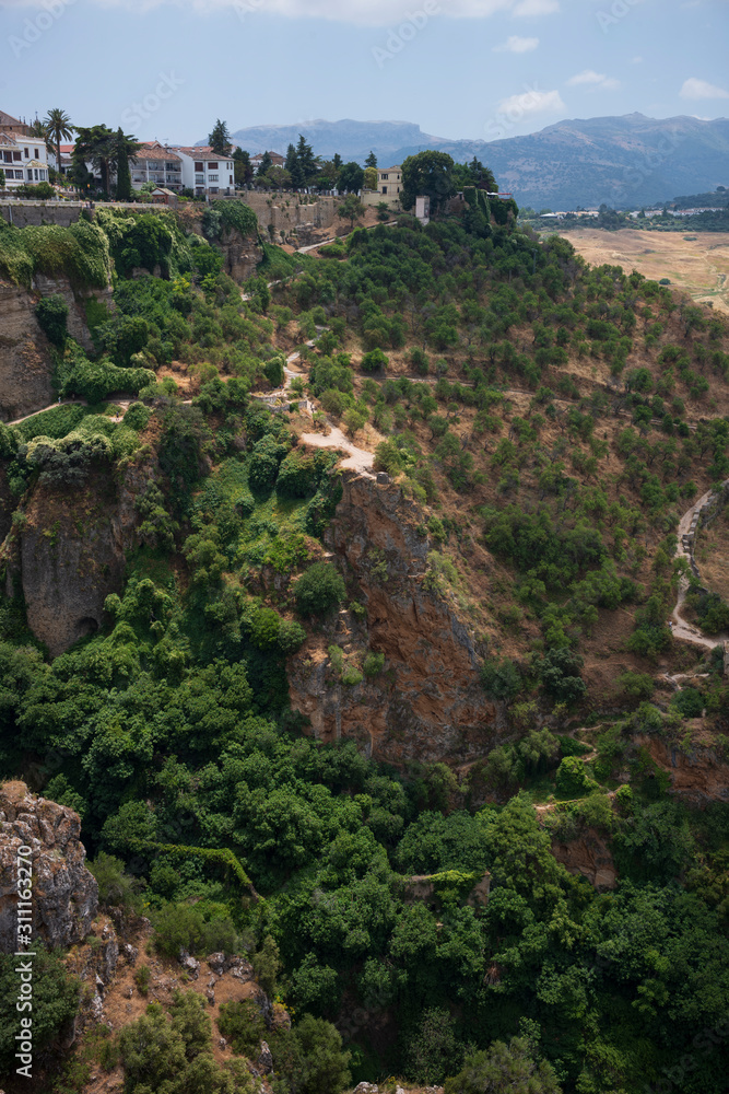 Ronda, Spain, a city in the Spanish province of Málaga, stand along a cliff on a sunny, summer day. Ronda, Spain, a city in the Spanish province of Málaga, stand along a cliff on a sunny, summer day.