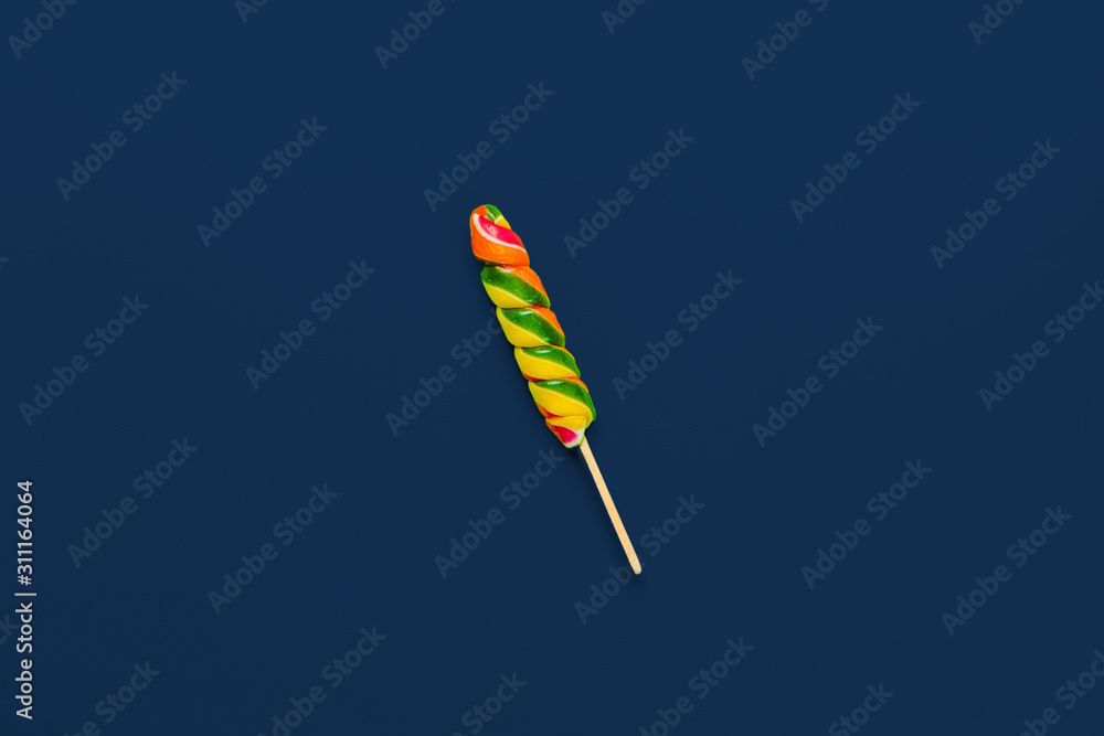 Colorful candy on classic blue background top view Colorful candy on classic blue background top view