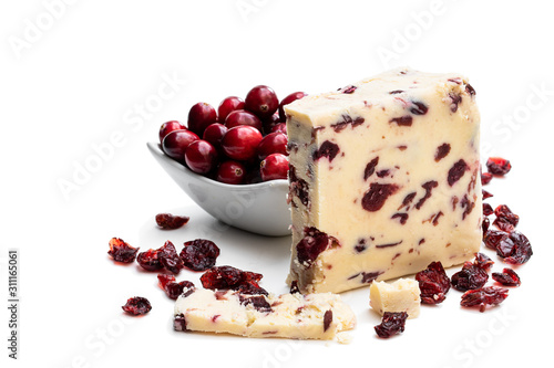 Cranberry cheddar cheese with wheat crackers isolated on white