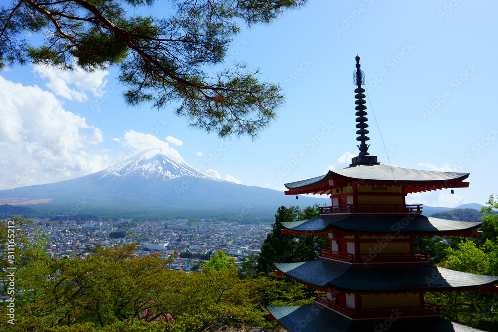 Fujiyoshida / Japan - May 02 2019: Red Chureito pagoda and Mountain Fuj