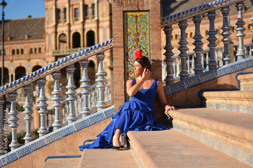 the flamenco dancer sitting on the steps