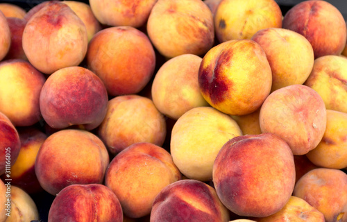 a bunch of juicy ripe peaches in an oriental bazaar