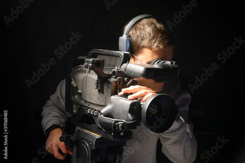 Cameraman using professional digital video camera .