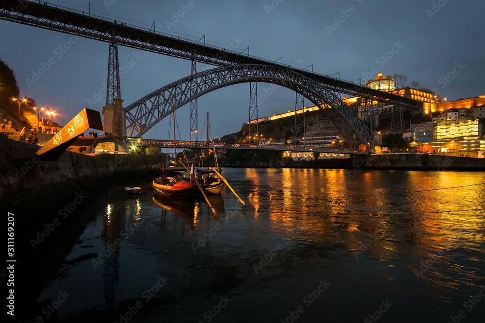 The bridge of the old city of Porto. The streets of Porto at night. Portugal.