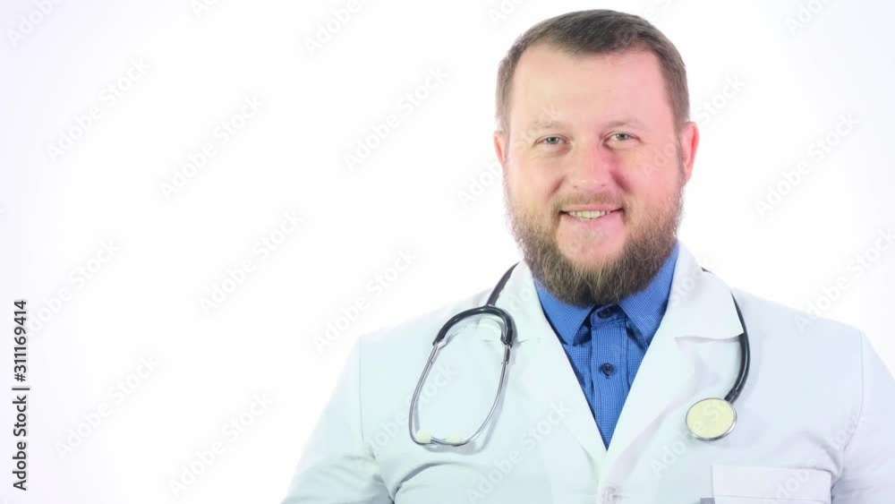 portrait of a bearded smiling male doctor in a white coat with a phonendoscope on his neck, healthcare and medicine concept. portrait of a bearded smiling male doctor in a white coat with a phonendoscope on his neck, healthcare and medicine concept.
